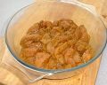 [Chicken marinading in jalfrezi spices]
